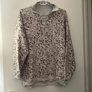 SOLD. Arie tan/brown cheetah print half zip. Size XS.